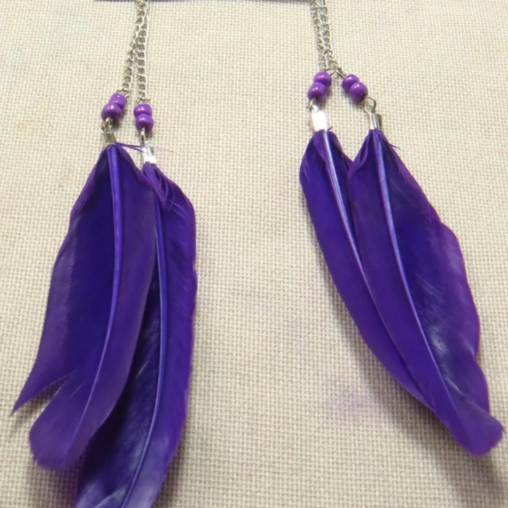 Feather earrings brand new